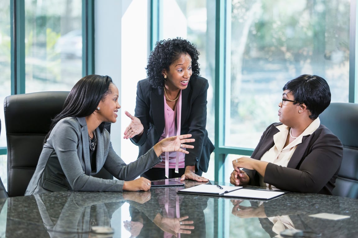 Colleagues Discussing with One Another  